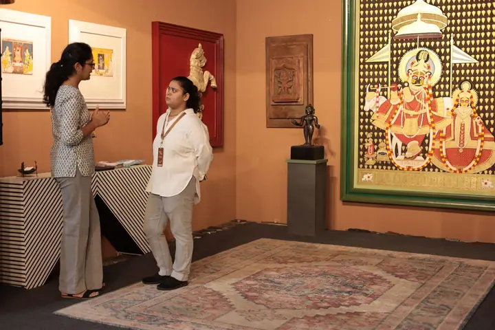 Visitors at a Pichwai art stall at FORHEX Fair 2024
