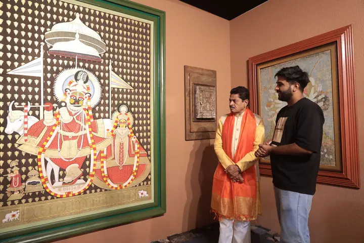 Guests beside a large Pichwai painting at FORHEX Fair 2024